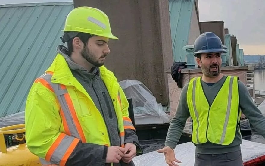 Pacific Custom Builders team on a project rooftop